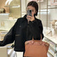 M22914 Lock It MM Brown Handbag