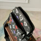 M21396 TRIO MESSENGER PM 25cm Sac Plat Graffiti Orange/black