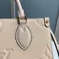 M45653 OnTheGo PM Monogram Empreinte leather white 25cm