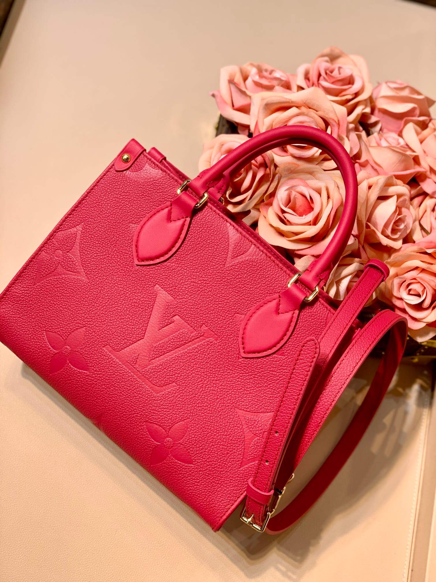 M45660 ONTHEGO PM tote bag Oversized monogrm empreinte leather Rose Red