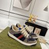 Low-top paneled suede and canvas sneakers in navy and gray.